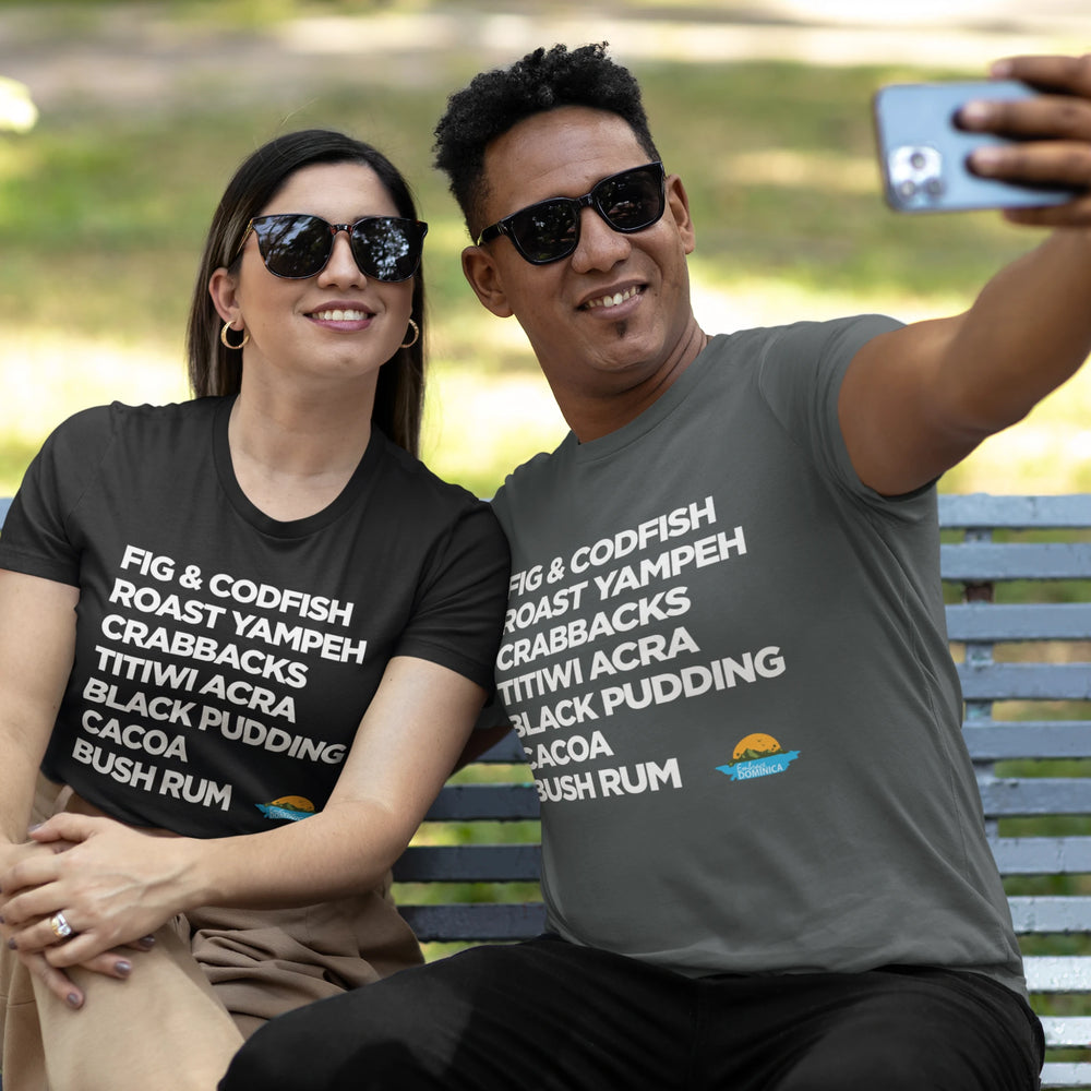 A couple taking a selfie wearing "Good Eating" unisex t-shirts in color black and dark heather, both with white text, by Embrace Dominica