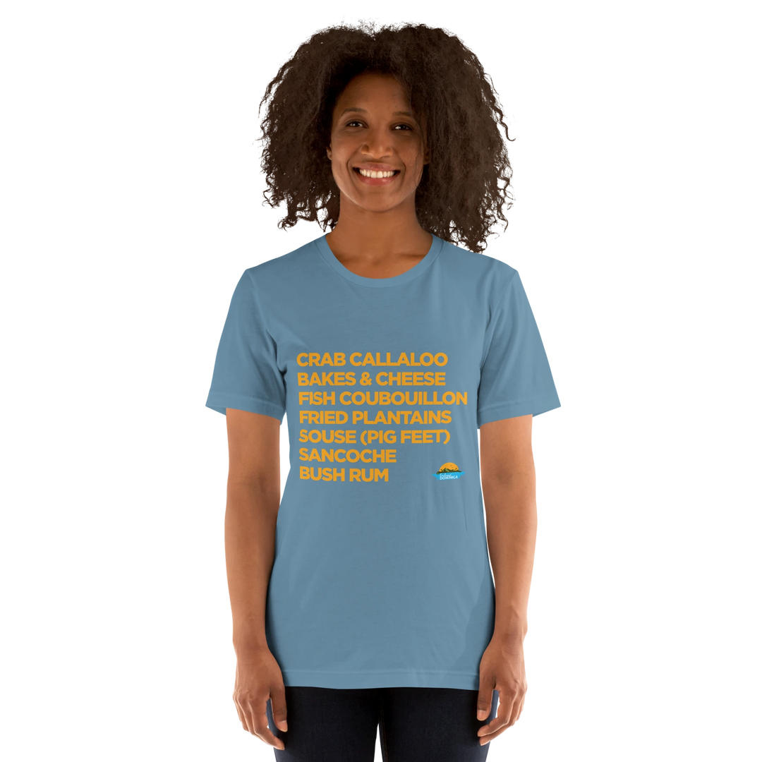 Brown skinned female model wearing a "Good Eating #2" steel blue colored t-shirt, with gold text, by Embrace Dominica