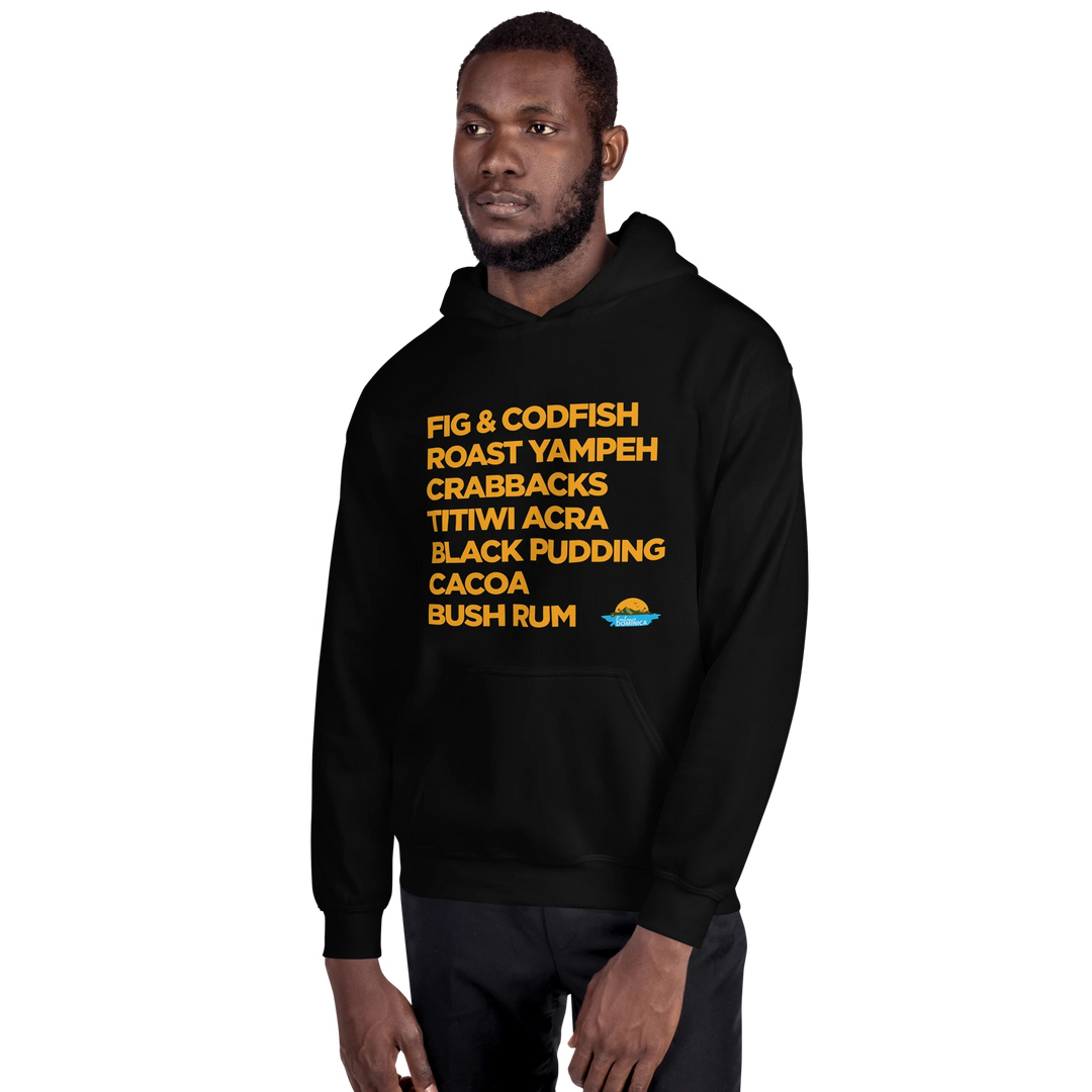 Dark skinned man wearing a black "Good Eating #1" hoodie, with gold text, by Embrace Dominica