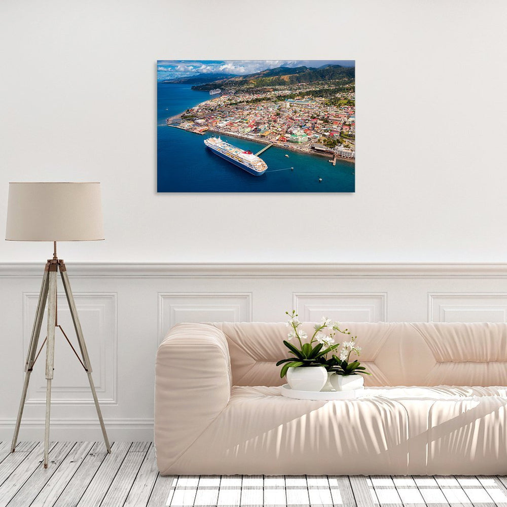 A canvas print of "Braemar I" by Yuri A Jones on a white wall above a cream colored couch.