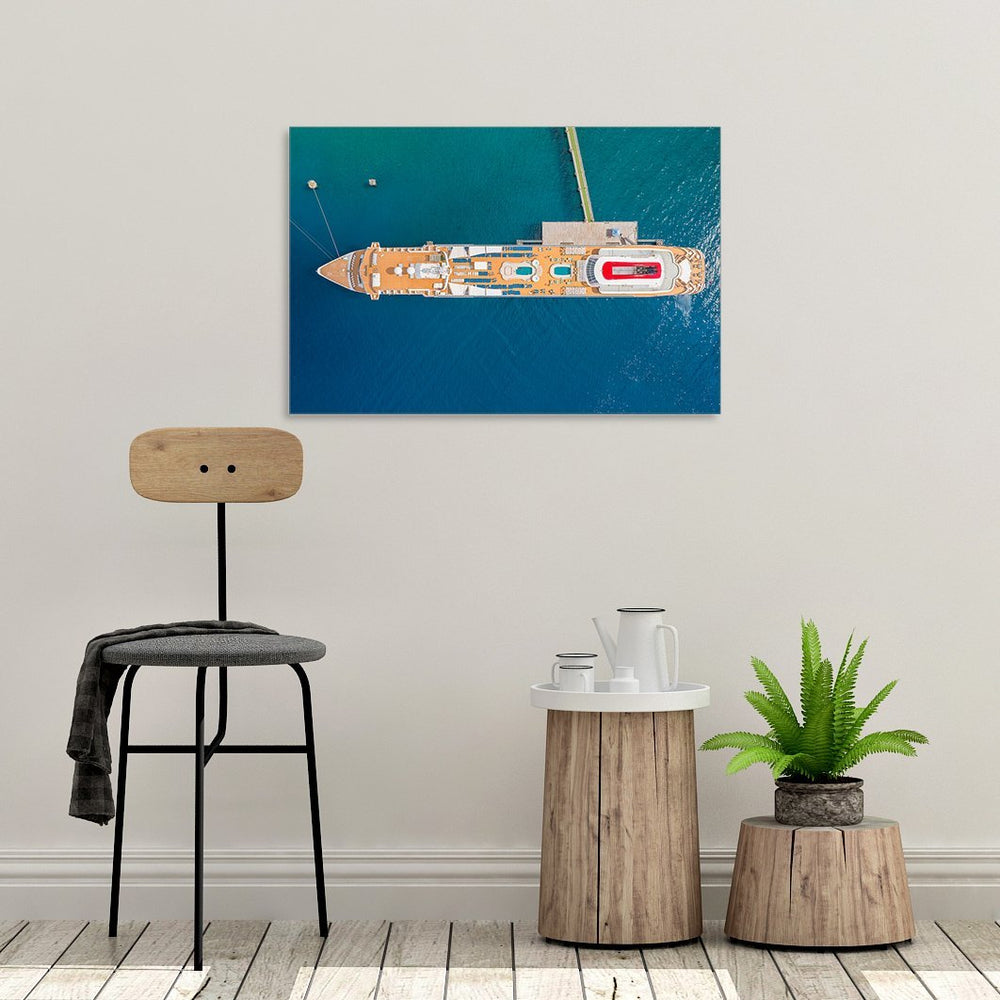 A canvas print of "Braemar II" by Yuri A Jones on a light colored wall.