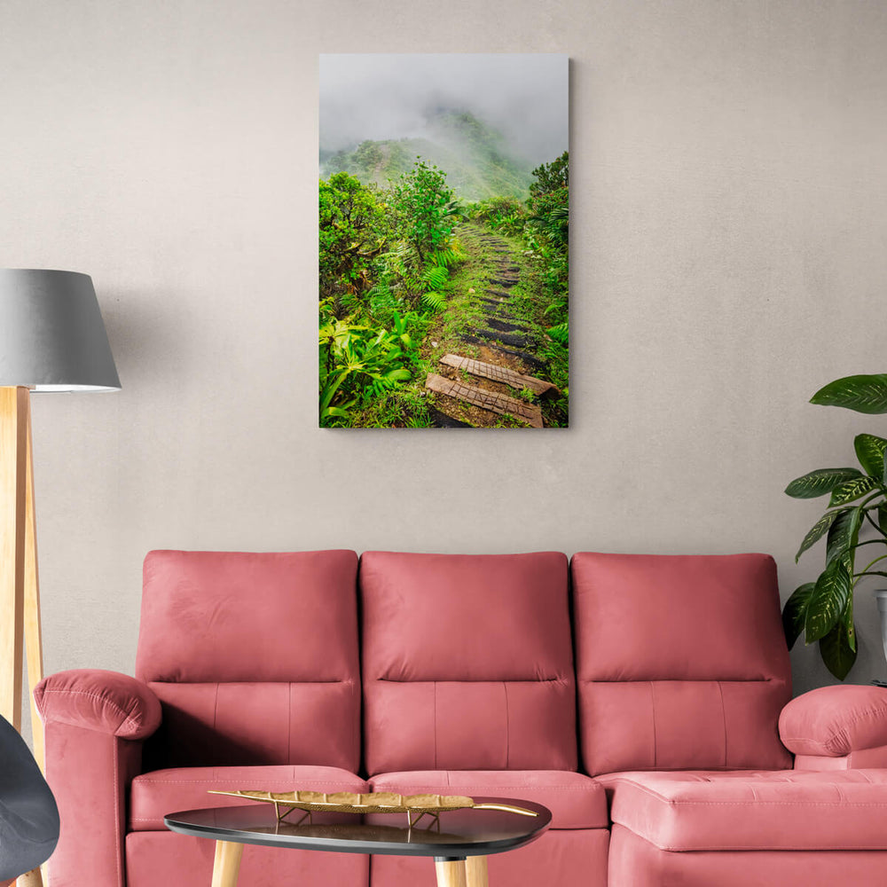 A canvas print of "Into The Mist" by Yuri A Jones on a light colored wall, hung above a dark pink sofa.