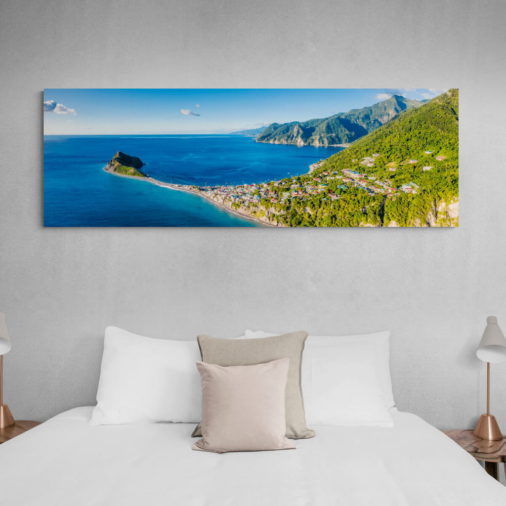 A canvas print of "Behind Scotts Head Panorama" by Yuri A Jones hanging above a bed, on a gray wall.