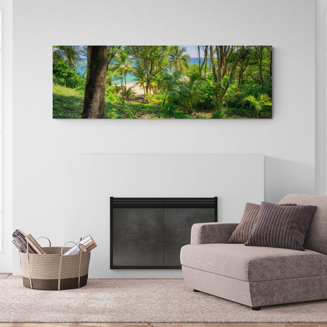A canvas print of "Entrance to Paradise" by Yuri A Jones on a white wall, hung above a fireplace and brown armchair.